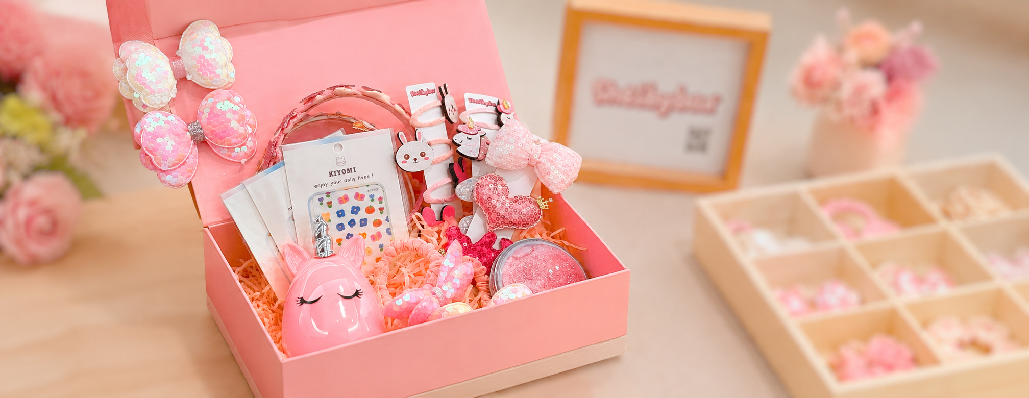 Pink girls hair accessories gift box with sparkly bows, clips, headbands and cute kids fashion accessories